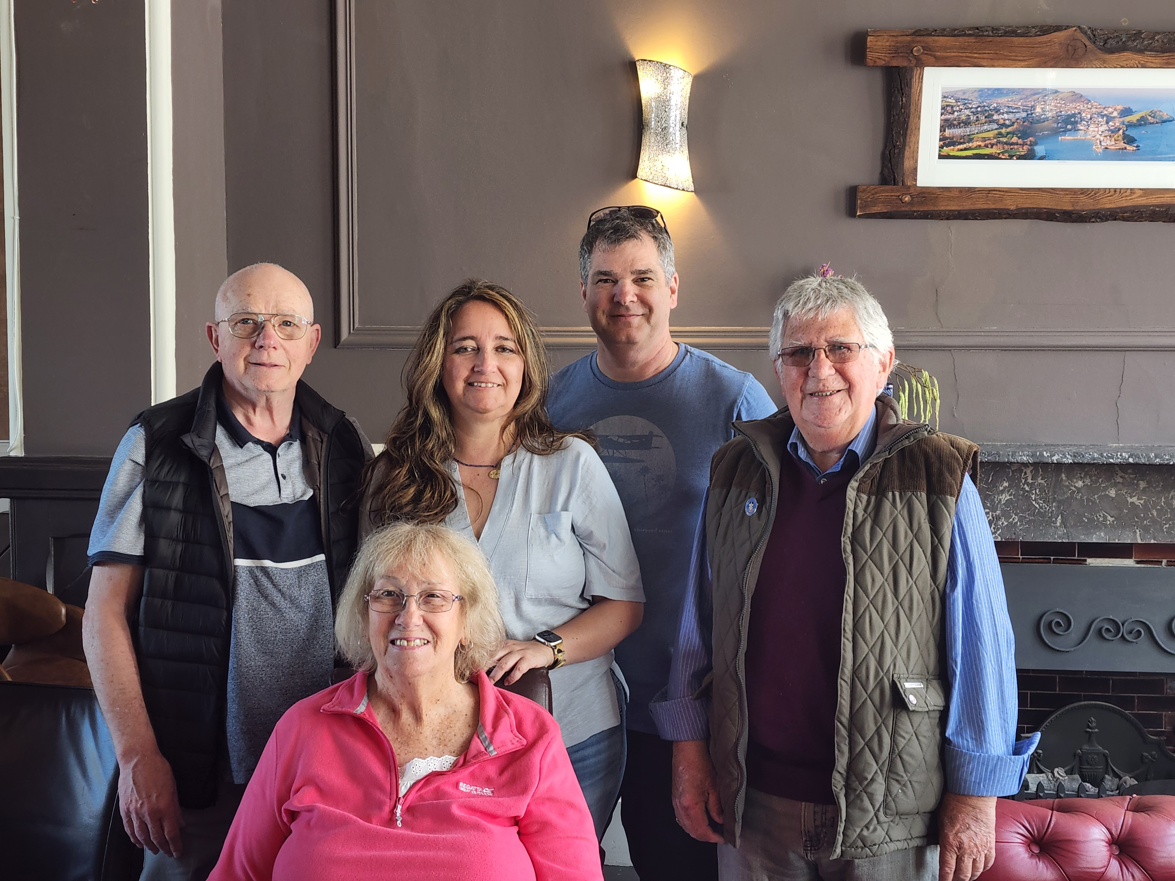Dale with his father, wife Monica, and the researchers who helped find them