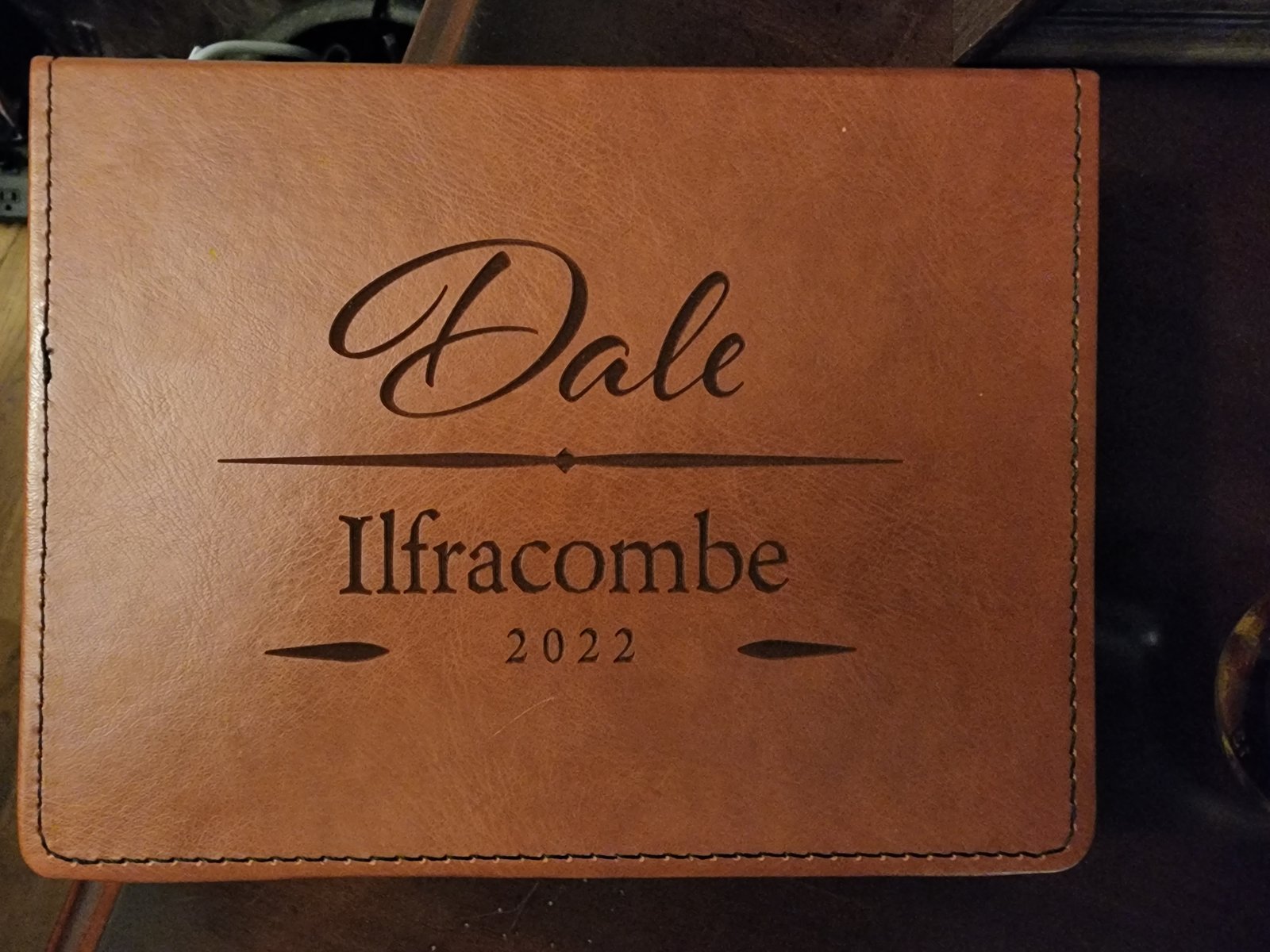 Personalized leather shot glass case engraved with 'Dale' and 'Ilfracombe 2022'