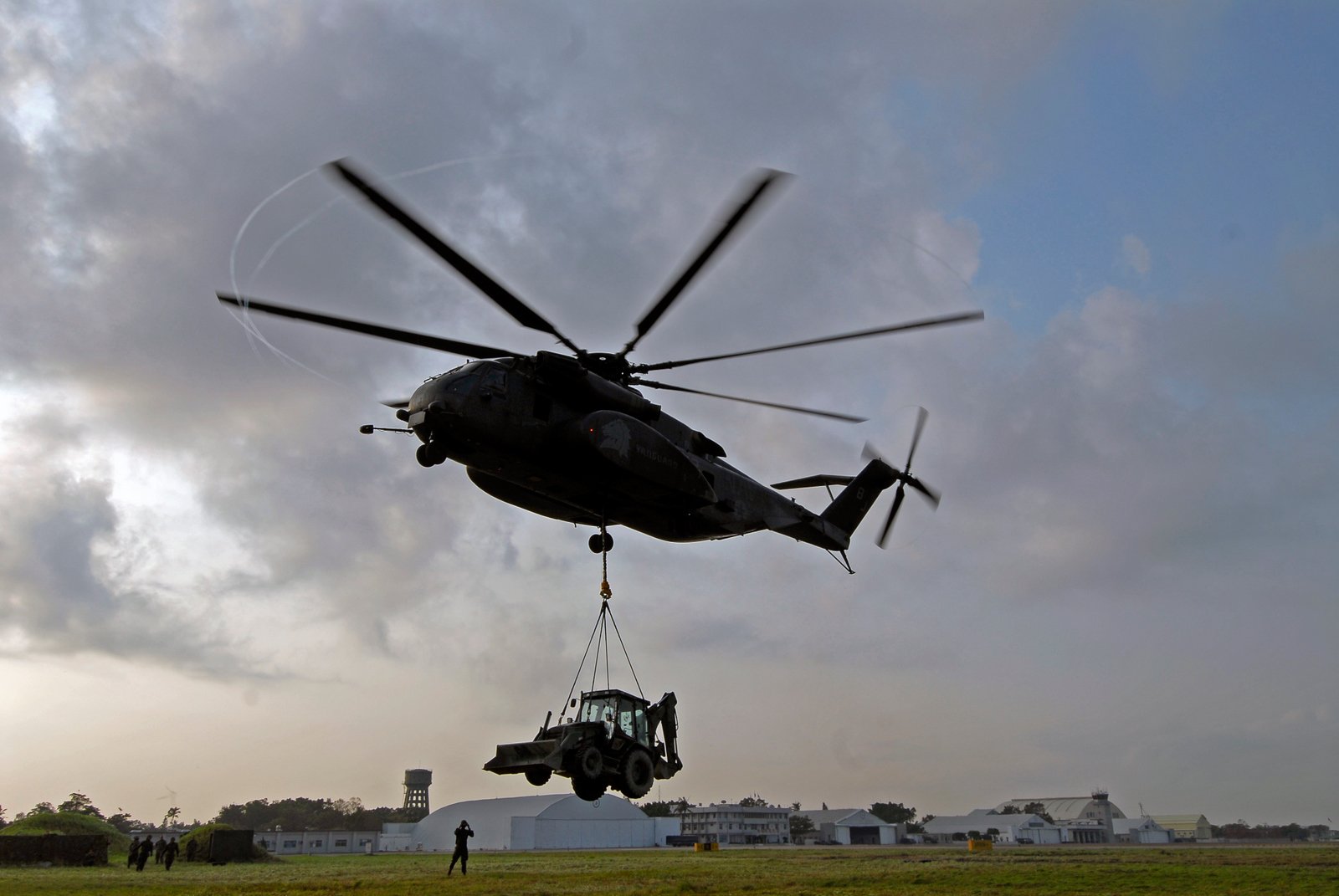 MH-53E Sea Dragon helicopter lifting a Caterpillar tractor during humanitarian aid operations after Typhoon Morakot in Tainan, Taiwan, 2009